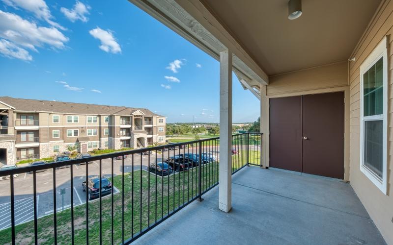 a balcony with a closet and railing