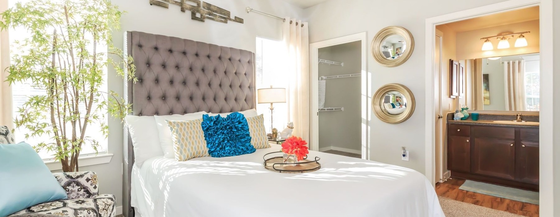 a bedroom with a bed and a chair