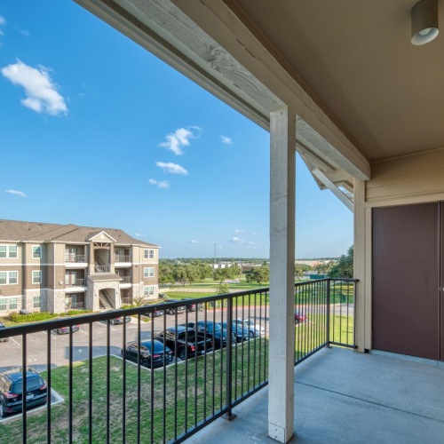 a balcony with a closet and railing