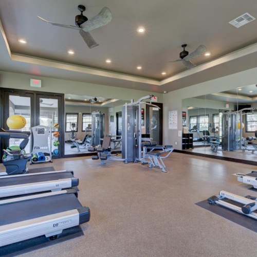 fitness center with exercise equipment